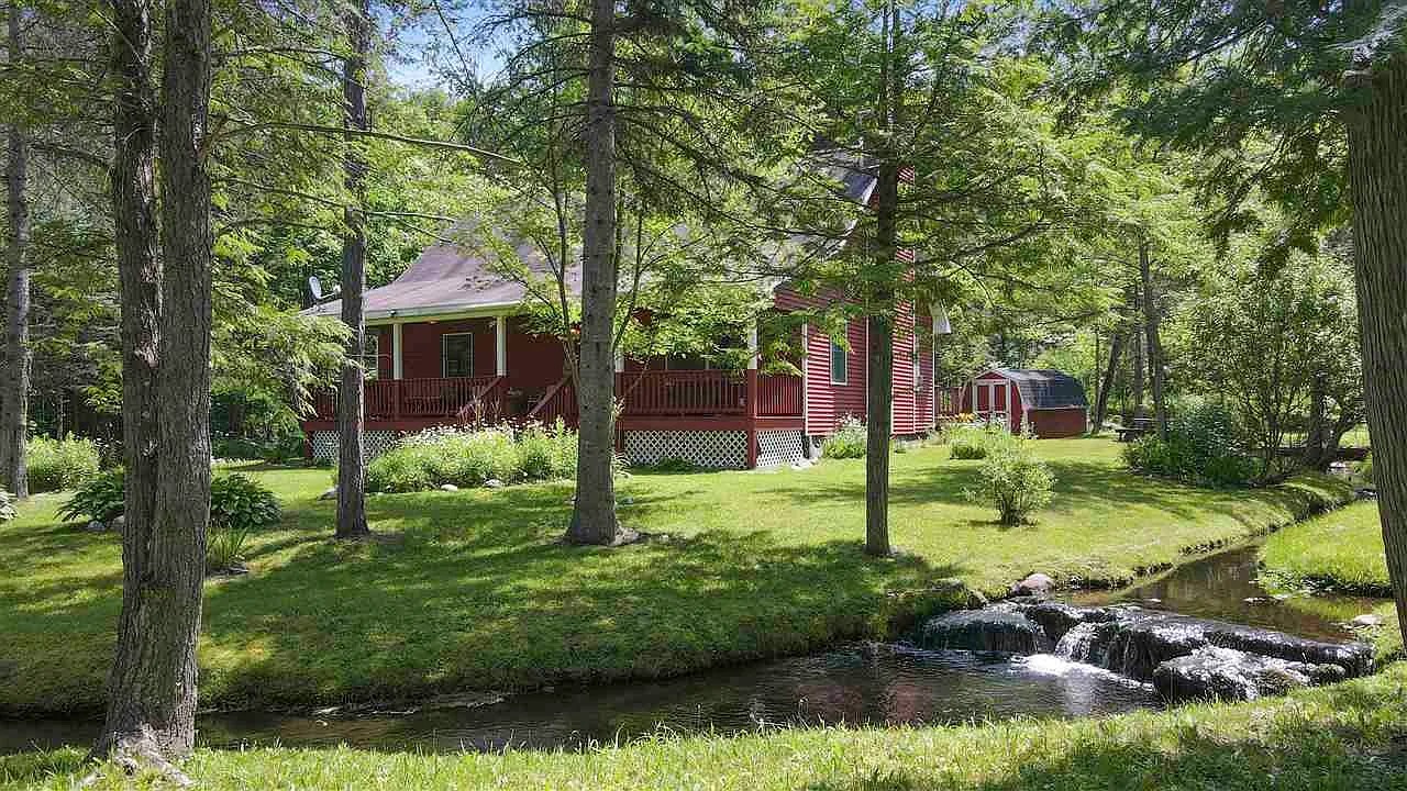 Cabin with Creek Frontage on 19.65 Acres in East Jordan, Michigan