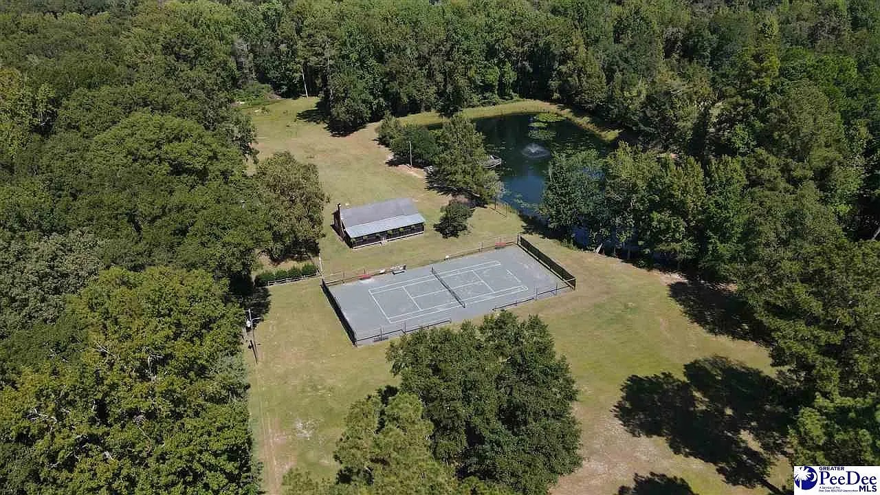 Home with Pond, Tennis Court, and Acreage in Bennettsville, South Carolina